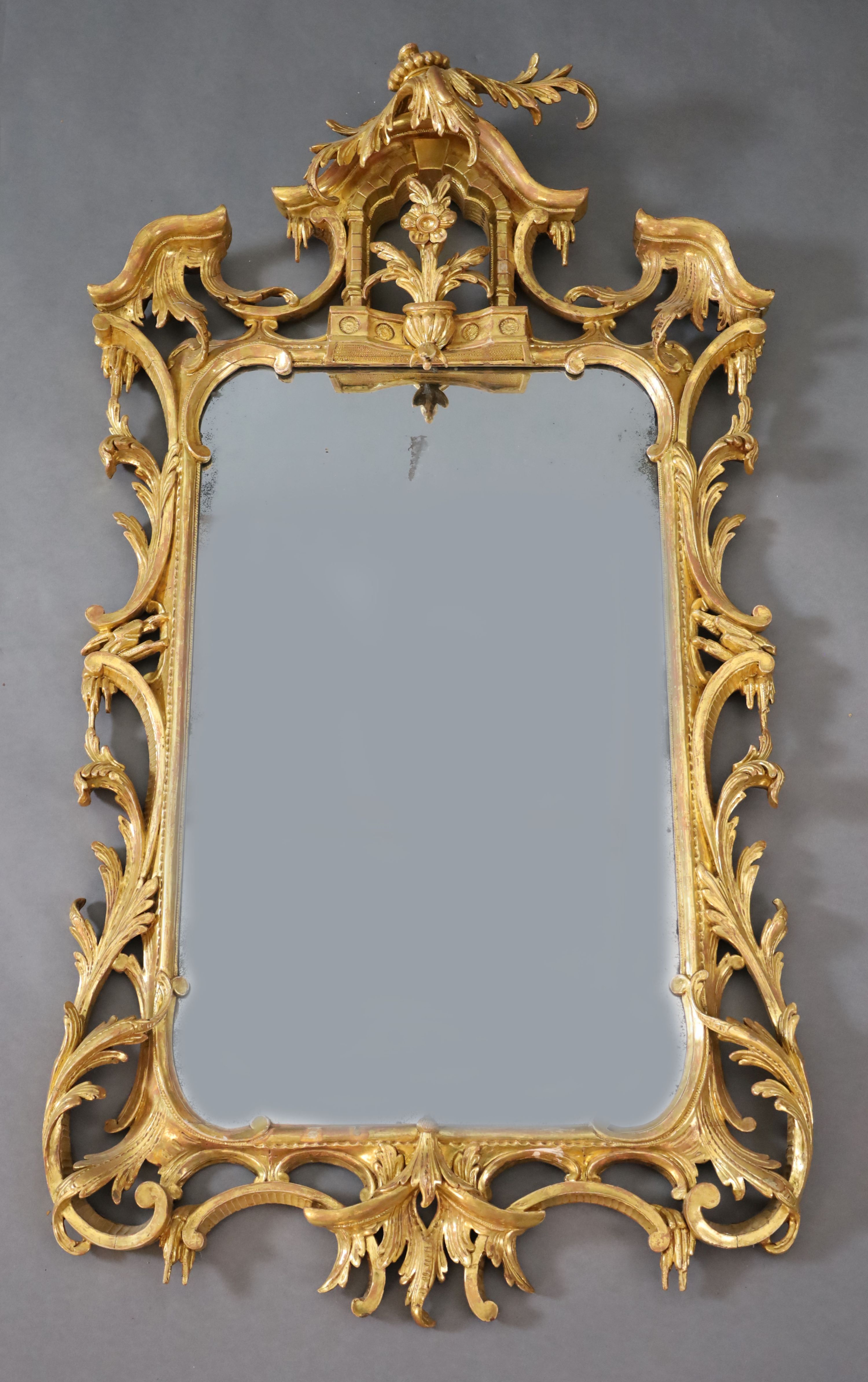 A George III Chippendale style carved giltwood wall mirror, W.1ft 10in. H.3ft 6in.